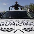 Soldiers use a pickup truck of the local municipal police in San Fernando, in th