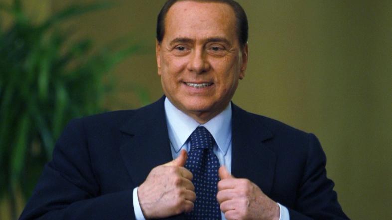 Italy's Prime Minister Silvio Berlusconi attends a joint news conference with Eg