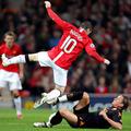 Wayne Rooney in Phillipe Mexes.