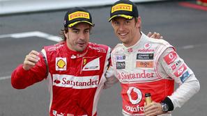 Fernando Alonso (Ferrari) in Jenson Button (McLaren)