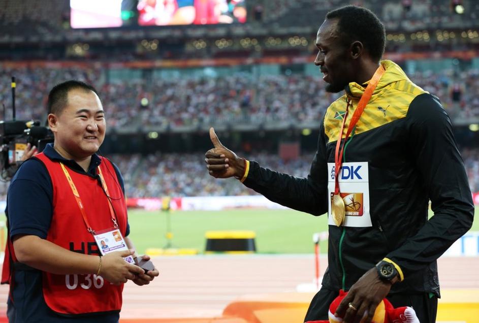 usain bolt snemalec sp atletika peking 200 metrov segway