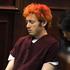 James Holmes po pokolu prvič na sodišču.