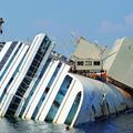 razno 12.09.13. The capsized cruise liner Costa Concordia lies surrounded by cra