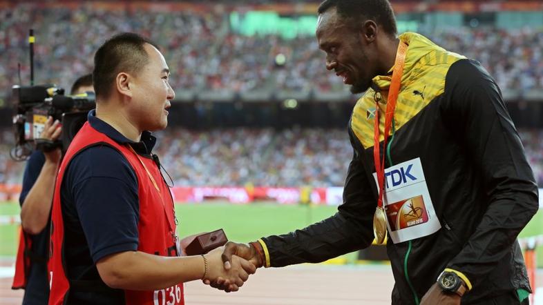 usain bolt snemalec sp atletika peking 200 metrov segway