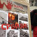 Na plakatu je napisano "desetletje Natove okupacije Srbije", nekateri mediji pa 