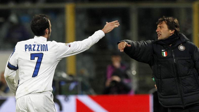 Pozdrav Pazzinija s trenerjem Leonardom. (Foto: Reuters)