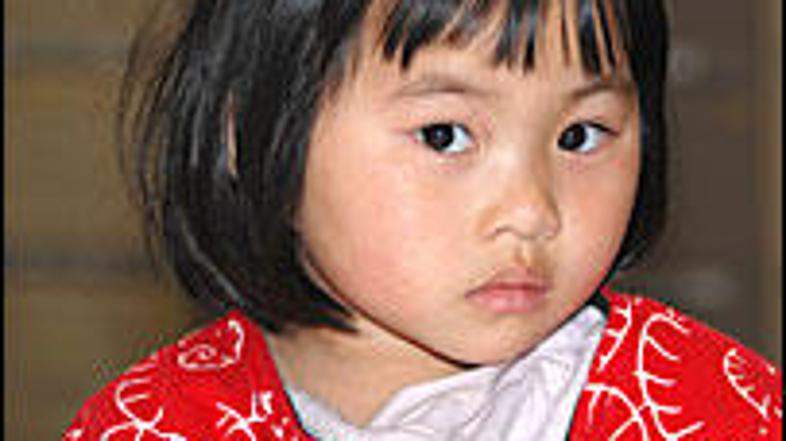 Qian Xun Xue je oče zapustil na železniški postaji.