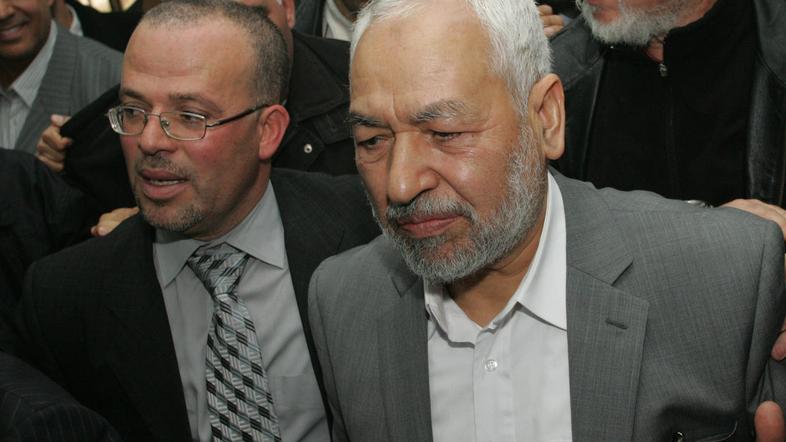 Rachid Ghannouchi je dočakal topel sprejem na letališču v Tunisu. (Foto: EPA)