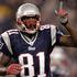 Randy Moss (New England) potrebuje še en ujeti touchdown za izenačenje rekorda.