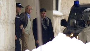 razno 12.12.12. Serbian police officers detain Miroslav Miskovic (C), a billiona