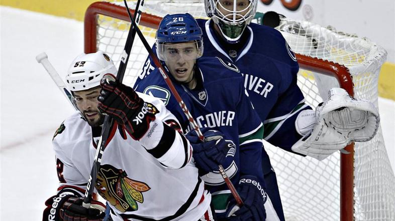 Schneider Corrado Bollig Vancouver Canucks Chicago Blackhawks NHL