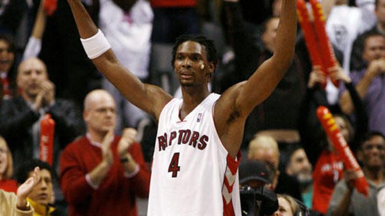 Chris Bosh (dvojni dvojček) se je veselil zmage nad Portlandom po dveh podaljški