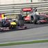 Sebastian Vettel (Red Bull) in Lewis Hamilton (McLaren)