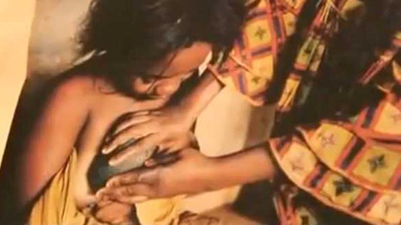 Polaganje vročih kamnov na deklico. (Foto: Current TV)