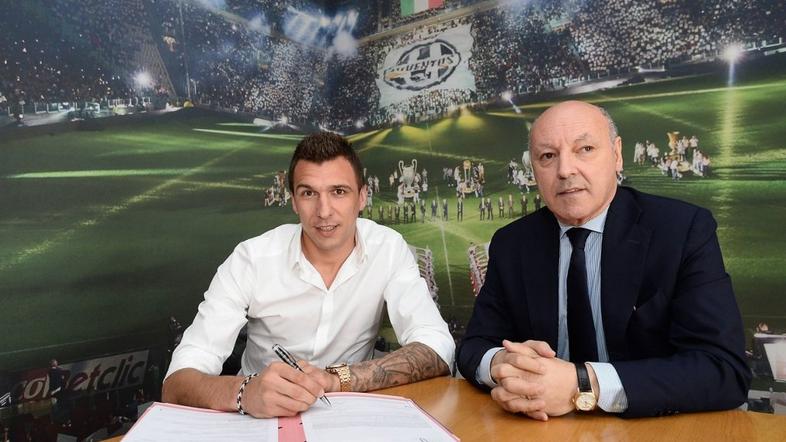 Mario Mandžukić in Giuseppe Marotta