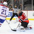 Brian Gionta in Cory Schneider na tekmi med New Jersey Devils in Montreal Canadi