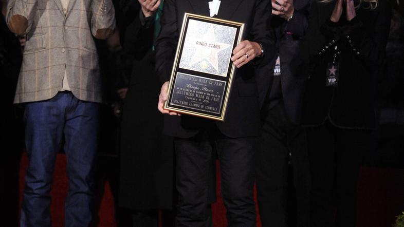 Ringo se je zvezde razveselil s svojo ženo. (Foto: Reuters)