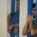 razno 18.11.13. zapor, zaporniki, Inmates look out of their cells at Nassiriya p