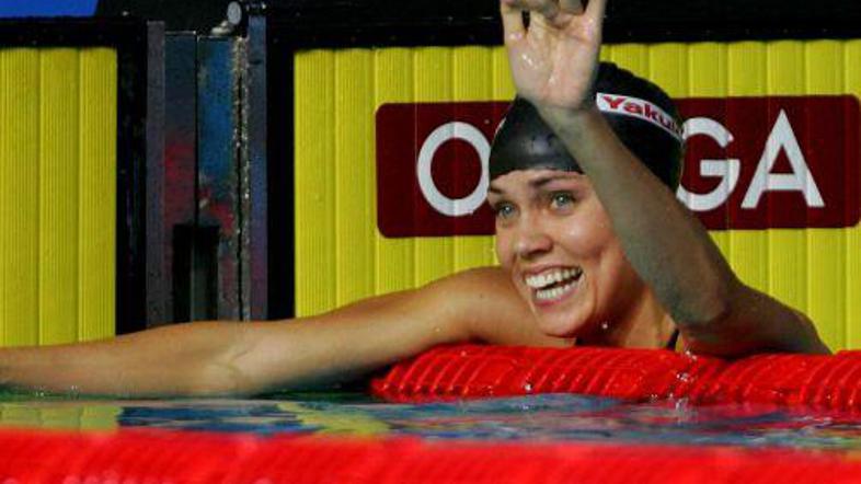 Natalie Coughlin se ob postavitvi novega rekorda zasluženo smeje.